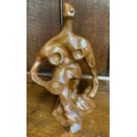 A modernistic pottery figure of a stylised man in