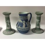 A pair of Wedgwood candlesticks decorated with fig