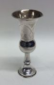 A small Edwardian silver engraved beaker decorated