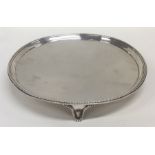 A fine quality circular silver salver with beaded