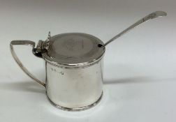 A good George III silver mustard pot with crested