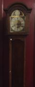 An oak cased grandmother clock on bracket feet. Es