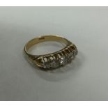 A good 18 carat gold five stone half hoop ring in