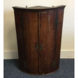 A Georgian oak bow front cabinet. Est. £20 - £30.