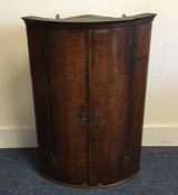 A Georgian oak bow front cabinet. Est. £20 - £30.