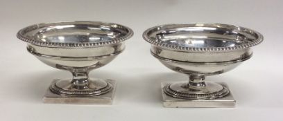 A good pair of Victorian silver salts on square ba