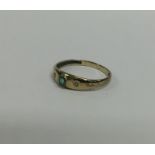 A small gold gypsy set ring. Approx. 1 grams. Est.