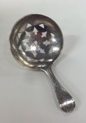 A George III bright cut silver caddy spoon. London