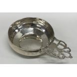 An early 18th Century silver bleeding bowl with pi
