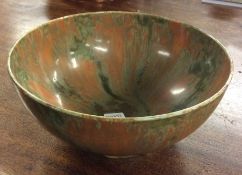 A decorative drip glazed circular bowl on pedestal