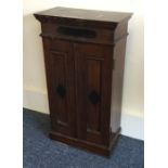 A small two door cupboard with moulded decoration.