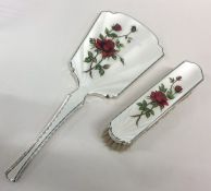 An attractive silver and enamelled mirror decorate