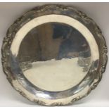 A large Continental silver salver with shaped rim.