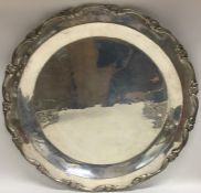 A large Continental silver salver with shaped rim.