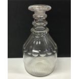 A Georgian glass decanter with fluted base. Approx