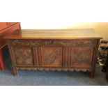 A good oak panelled coffer with hinged top to carv
