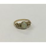 An Antique opal and diamond seven stone ring in cl