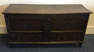 A Georgian oak two drawer hinged top coffer / mule