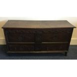 A Georgian oak two drawer hinged top coffer / mule