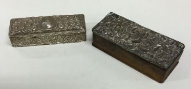 A rectangular silver embossed box together with on