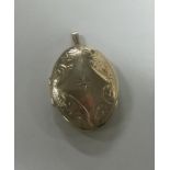 A 9 carat oval locket with central diamond. Approx