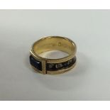 A Georgian 18 carat gold and enamelled mourning ri