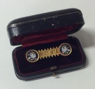 A cased micro-mosaic 'Roma' brooch in gold frame.