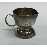 An unusual Georgian silver double lipped measuring