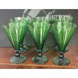 A set of six large tapering green drinking glasses