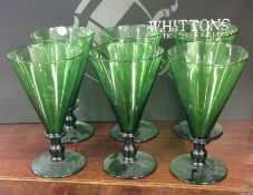 A set of six large tapering green drinking glasses