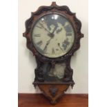 A Victorian mahogany mantle clock with scroll deco
