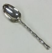An Edwardian silver dessert spoon of Chinese desig