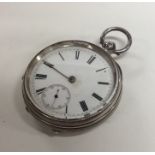 A silver open faced pocket watch with white enamel