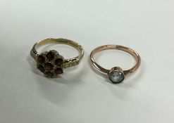 A circular garnet cluster ring together with one o