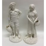 A pair of Royal Worcester decorative figures on te