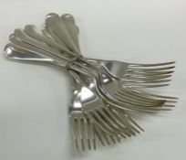 A heavy set of twelve rat tail silver dinner forks