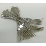 A heavy set of twelve rat tail silver dinner forks