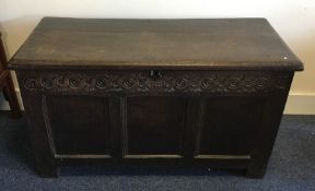 A good Georgian oak hinged top coffer with carved