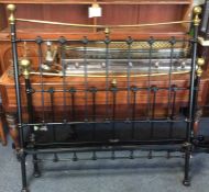 A brass and iron double bed. Est. £50 - £80.