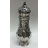 A good quality Continental silver caster decorated