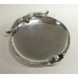 OMAR RAMSDEN: A heavy silver circular dish of typi