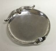 OMAR RAMSDEN: A heavy silver circular dish of typi