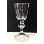 A baluster shaped Georgian wine glass with inverte