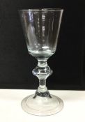 A baluster shaped Georgian wine glass with inverte