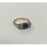 A sapphire and diamond five stone ring in 18 carat