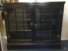 A large Georgian oak two door side cabinet. Est. £