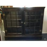 A large Georgian oak two door side cabinet. Est. £