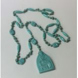 An unusual turquoise mounted necklace depicting sc