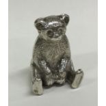 A novelty silver figure of a bear in seated positi