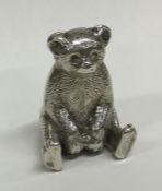 A novelty silver figure of a bear in seated positi